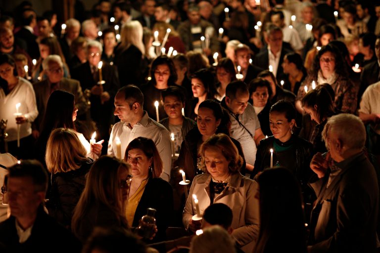 Orthodox,Christian,Worshiper,Holds,Candles,During,An,Easter,Vigil,Mass